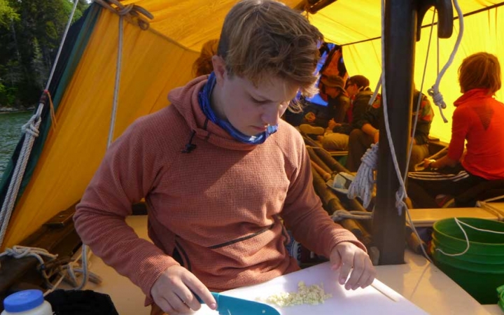 middle schoolers learn cooking skills on outdoor leadership course 